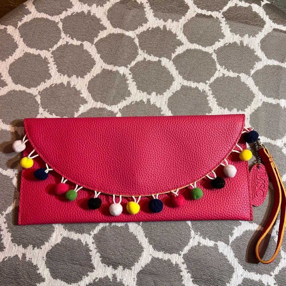 Pink Pebbled Clutch with Playful Tassel Pom Pom Trim